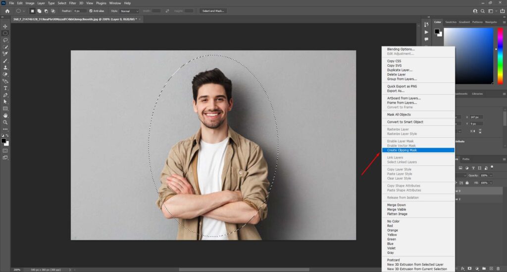 Photo editing software with the Layer menu open and Create Clipping Mask option highlighted, showing a mask outline around a man with crossed arms.