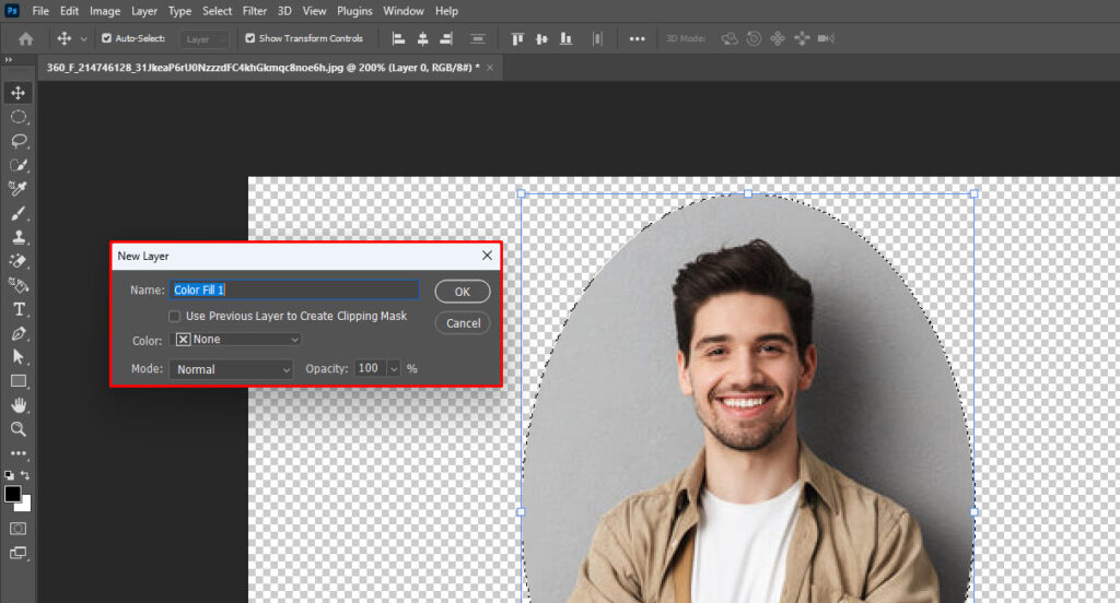 Photo editing software showing the New Layer dialog box with options for creating a solid color fill layer, over an image of a man with crossed arms in an oval shape against a transparent background.