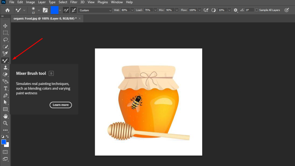 Photoshop with a honey jar image, highlighting the Brush tool for painting on the layer mask.