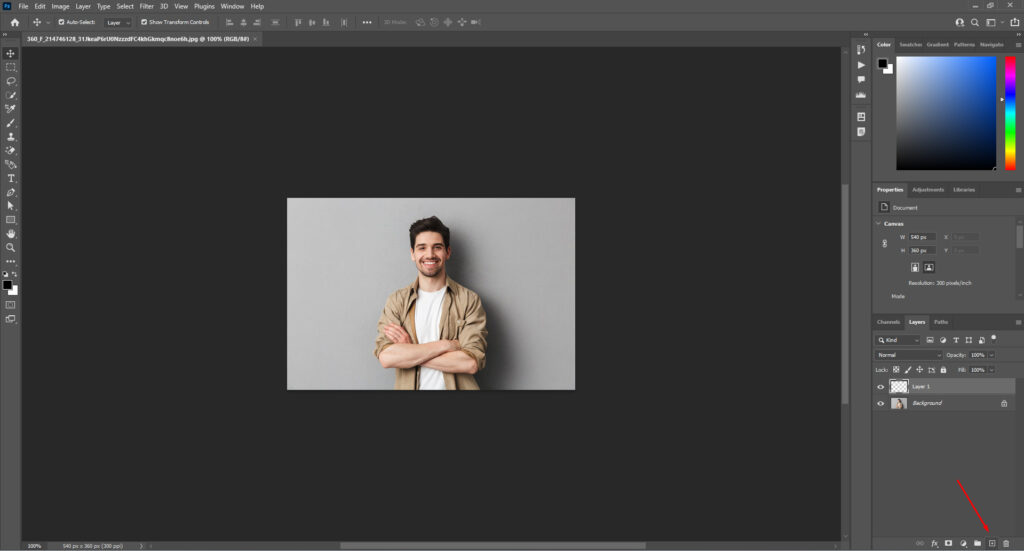 Photoshop with an image of a man, highlighting the icon for adding a new transparent layer.